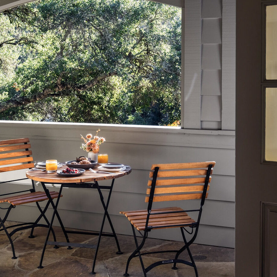 Breakfast set on table outdoors on Cottage Room porch