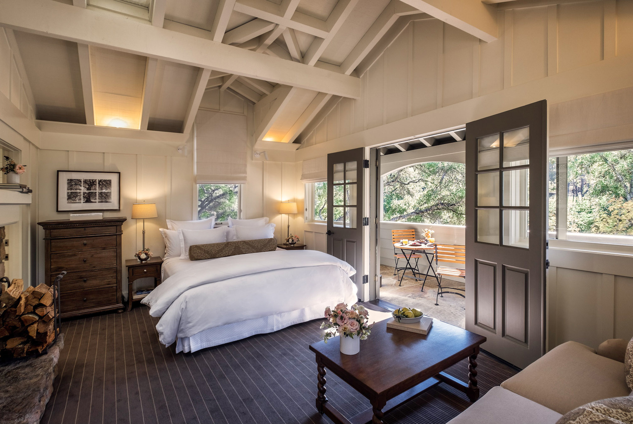 Cottage Room with bed, sitting area and doors to private porch