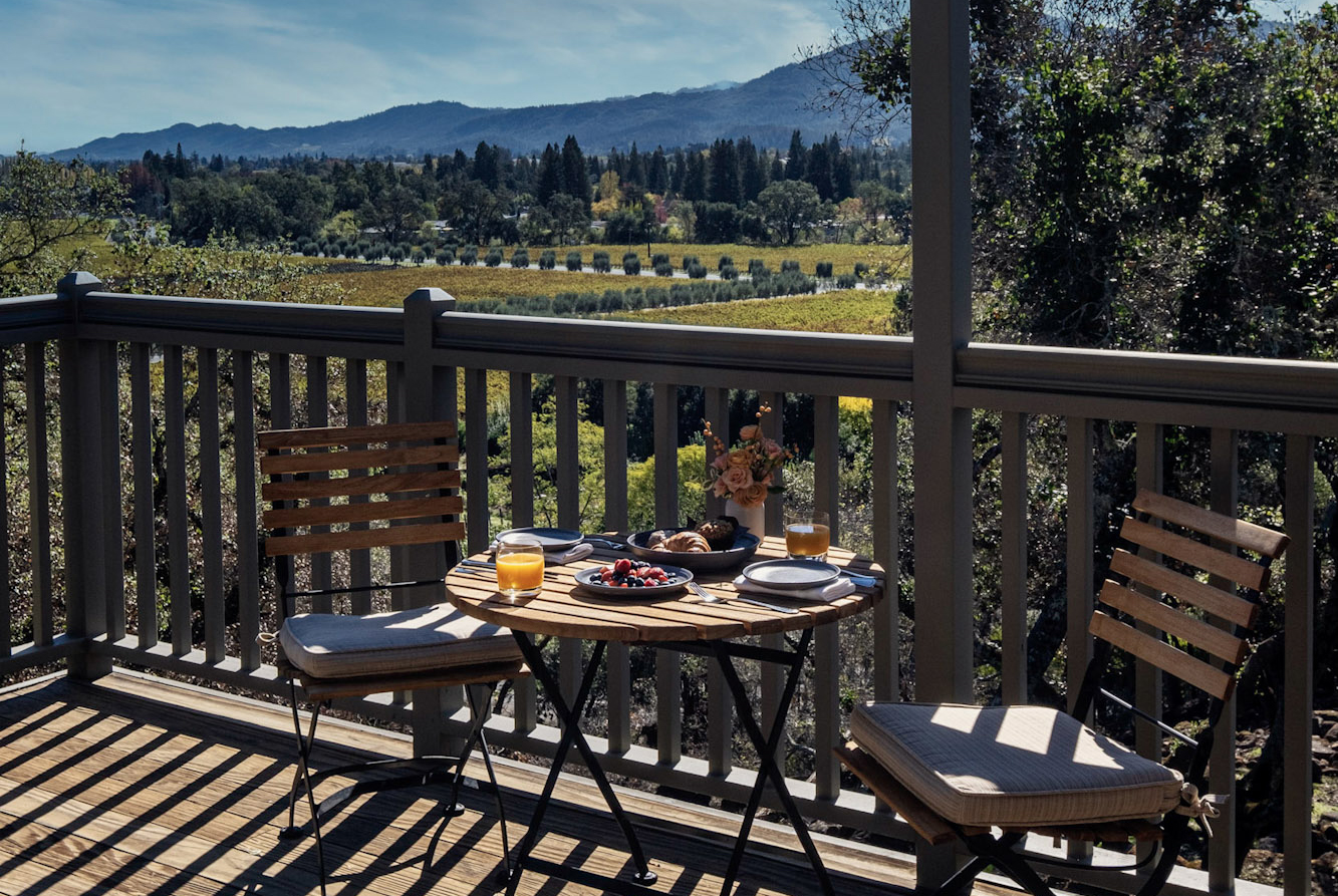 Treeline Suite deck set for dining with a view of Napa valley