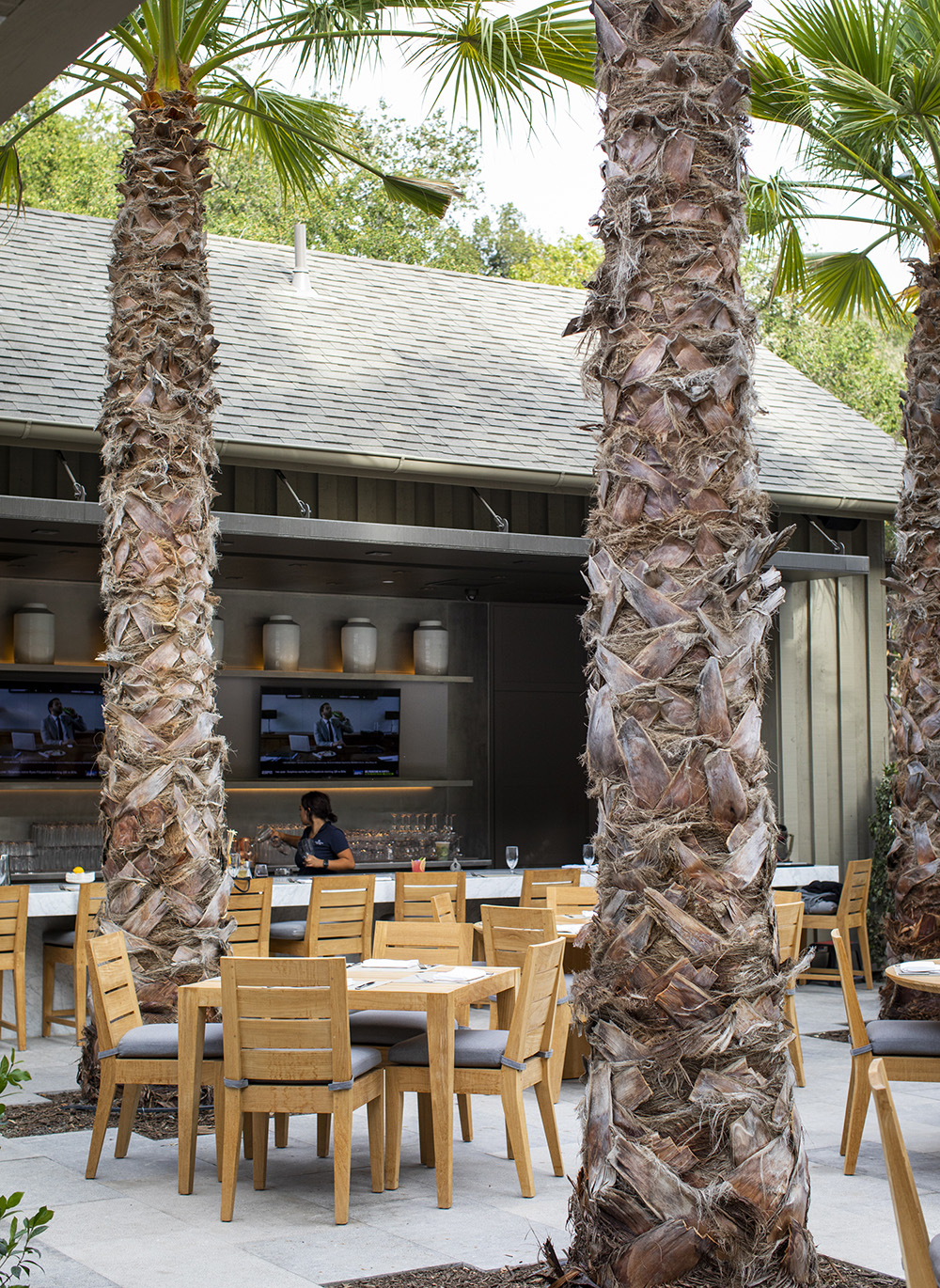 Exterior view of the outdoor Terrace Cafe seating and bar area in Napa Valley.