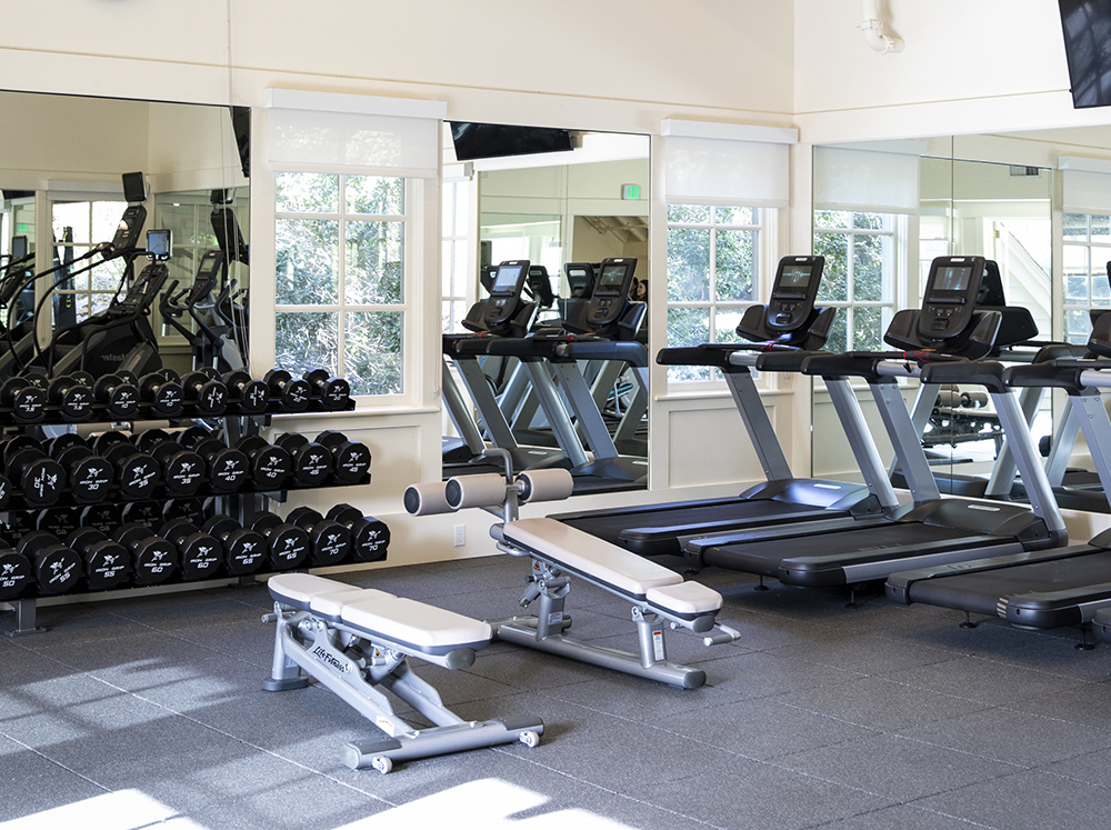 Interior view of the fitness room fitted with treadmills and free weights at our Meadowood Napa Valley resort.