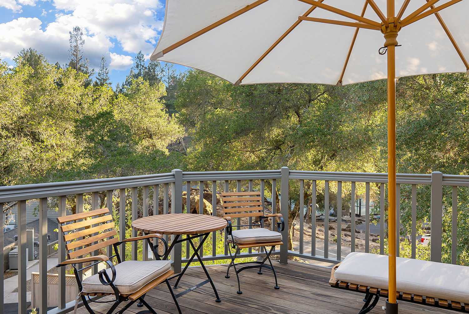Oakview Room outdoor deck with chairs and umbrella