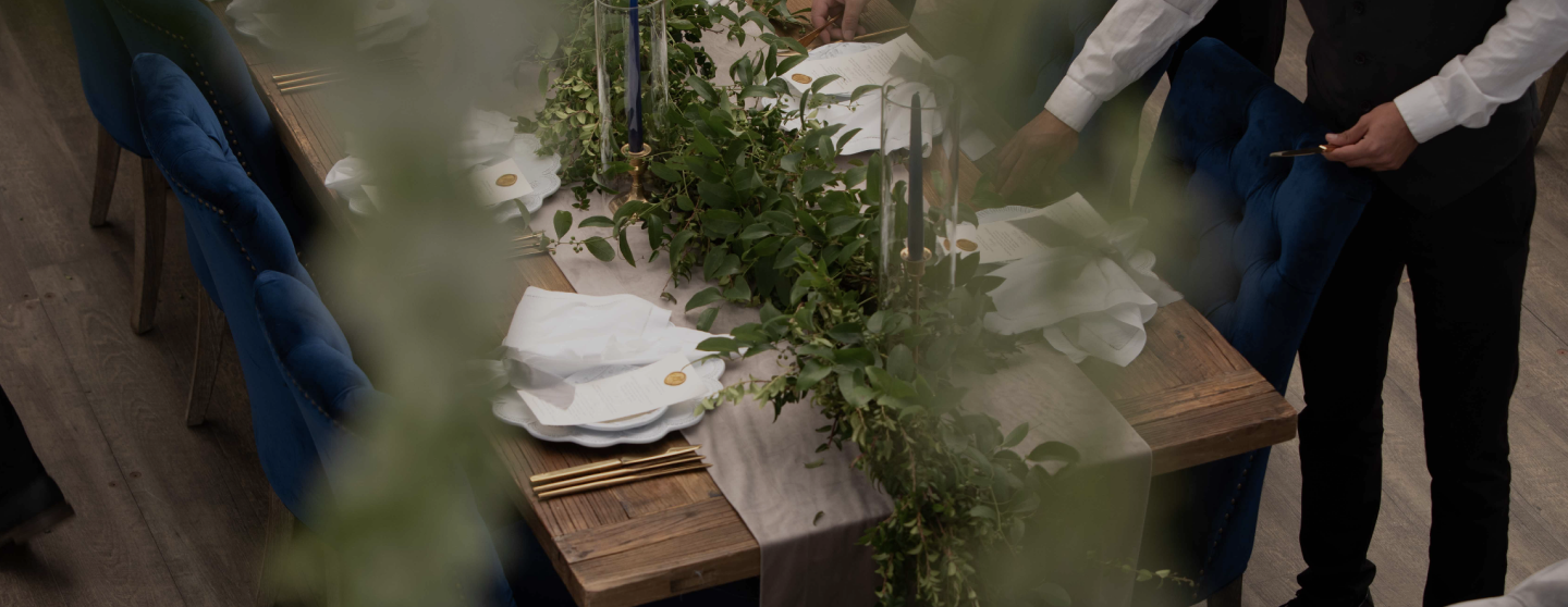 Banquet servers setting a table for an event