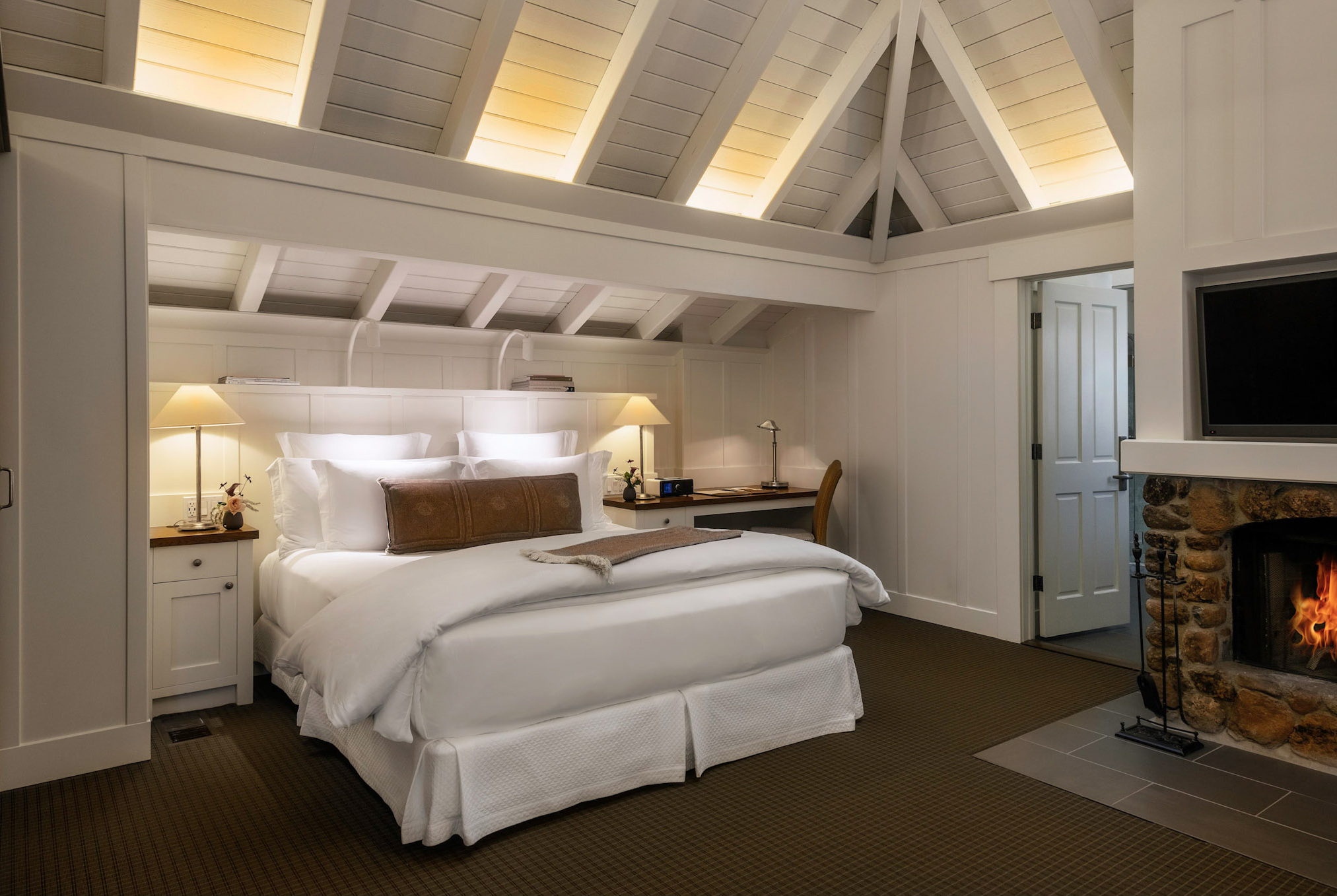 Interior view of the Oakview Room bedroom nook and fireplace at our luxury Napa Valley resort.