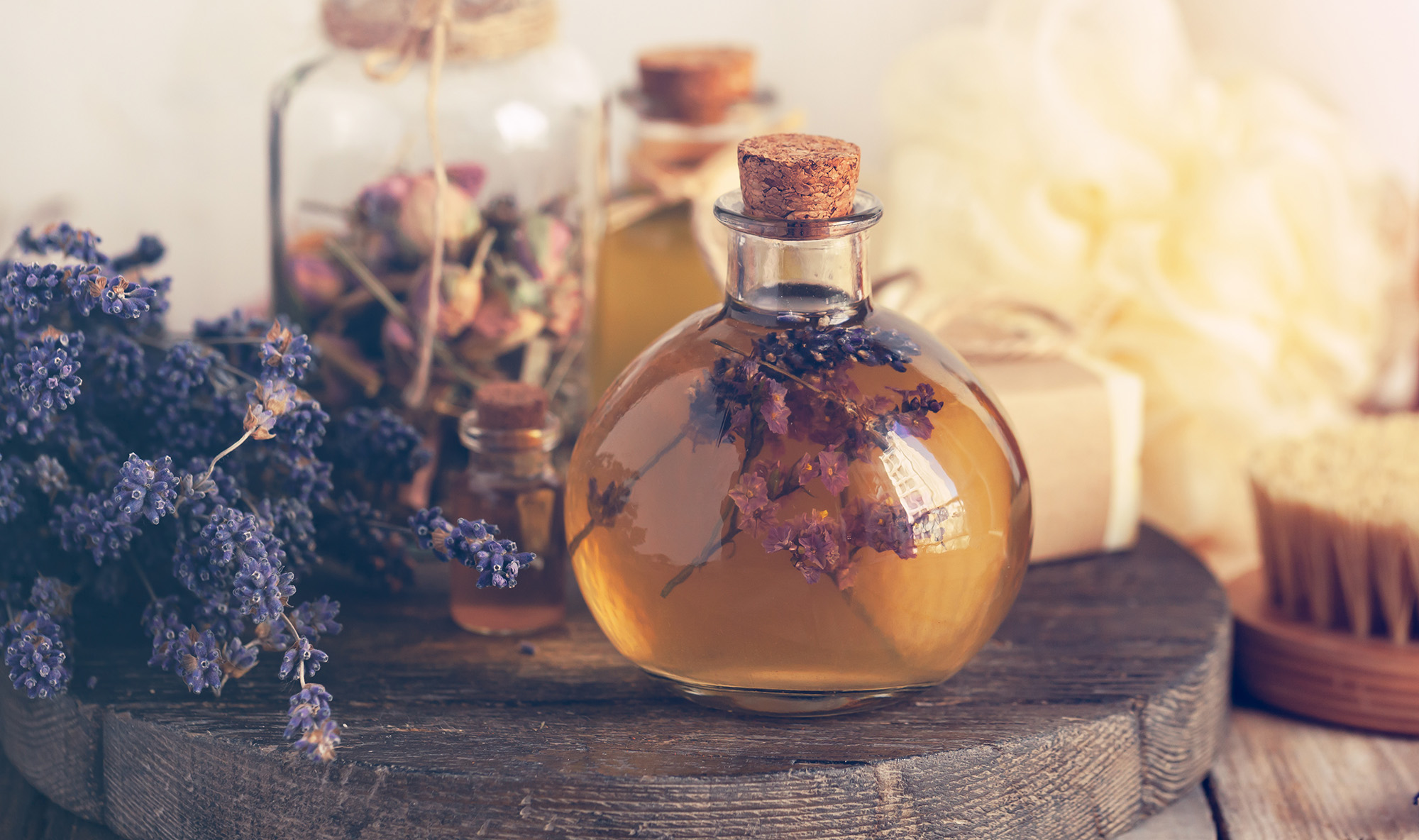 Essential oils in bottles with lavender
