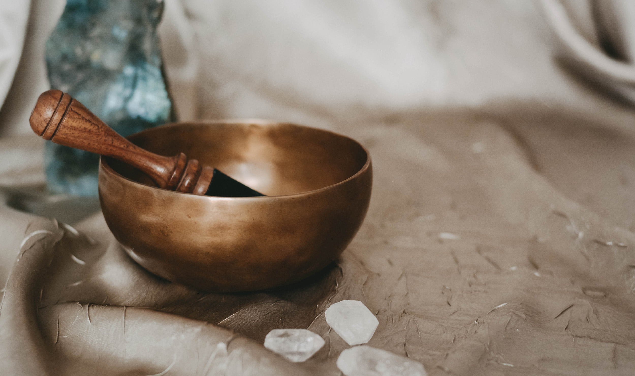 Close up image a sound therapy bowl, brush and some crystals at our luxury spa resort near St. Helena.