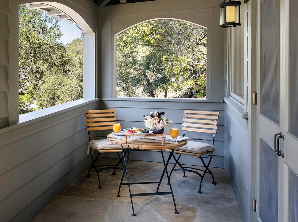 Breakfast on bistro table on outdoor porch