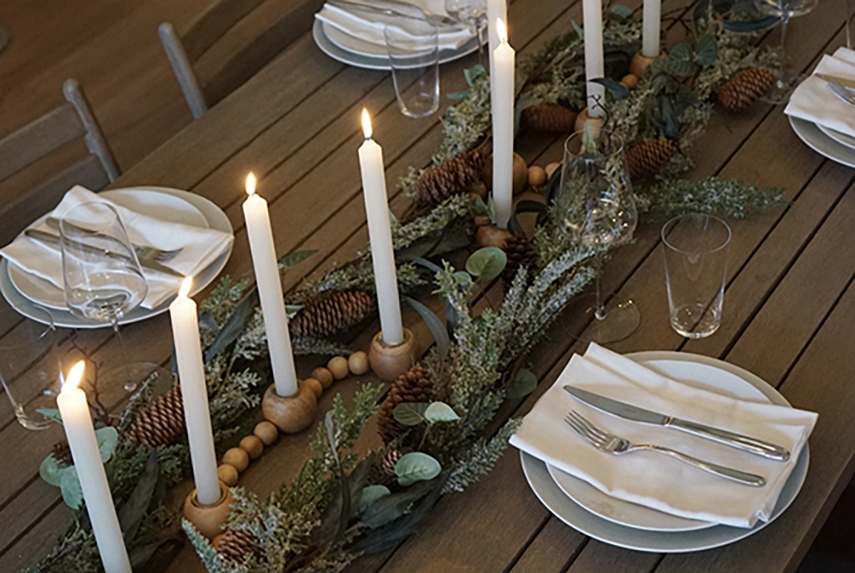 Table set with candles and holiday decor